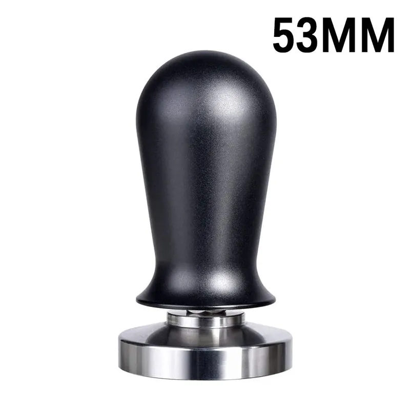 Black silicone coffee tamper pad with stainless steel base for non-slip espresso preparation