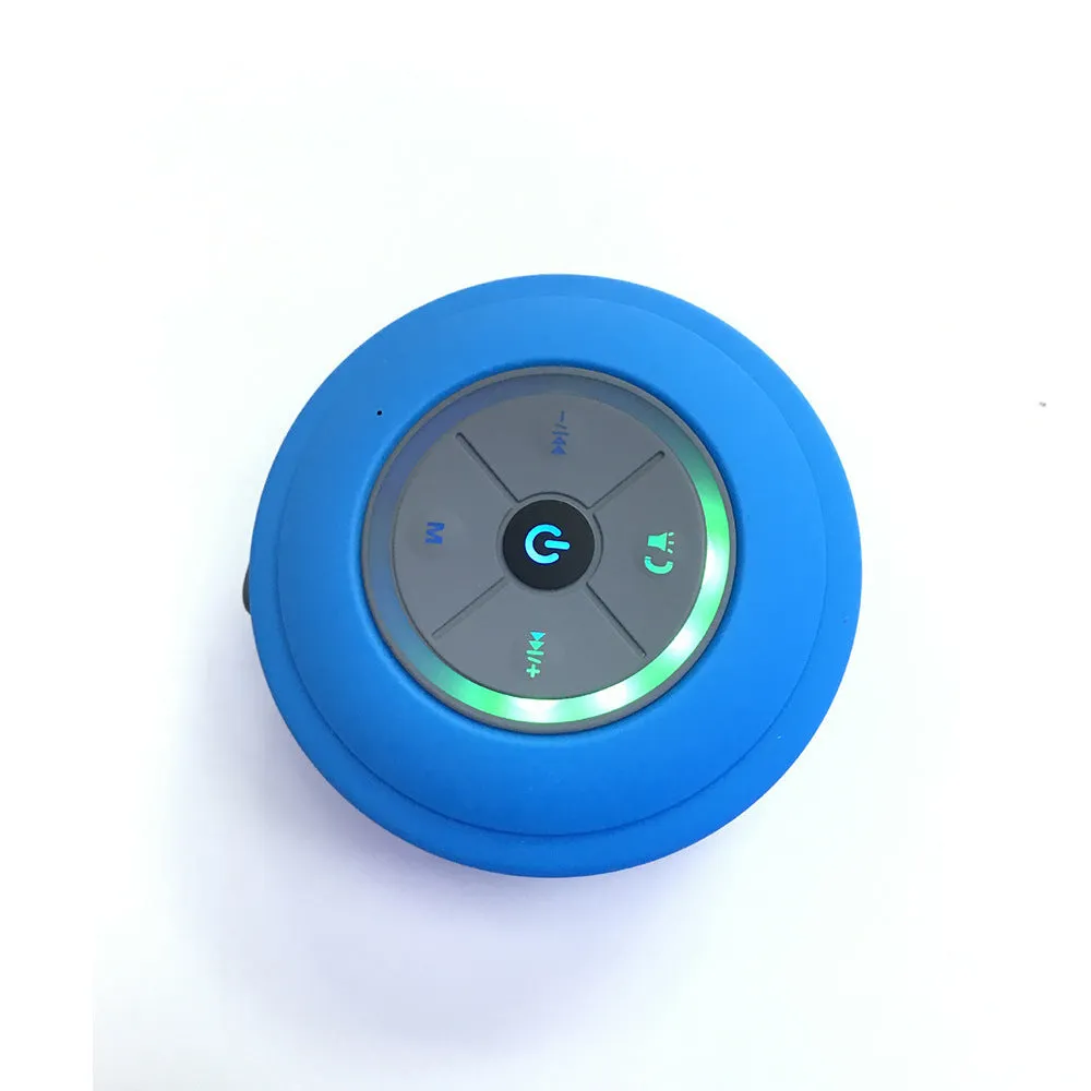 Waterproof suction cup Bluetooth speaker in black attached to a tiled wall