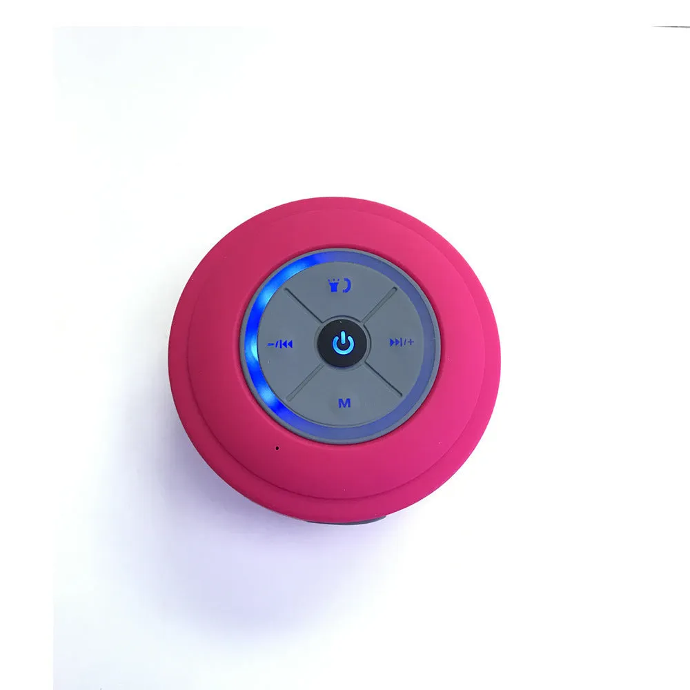 Waterproof suction cup Bluetooth speaker in black attached to a tiled wall