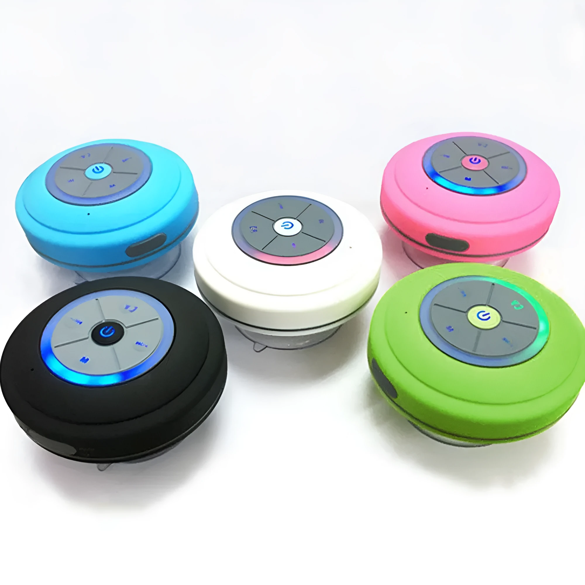 Waterproof suction cup Bluetooth speaker in black attached to a tiled wall
