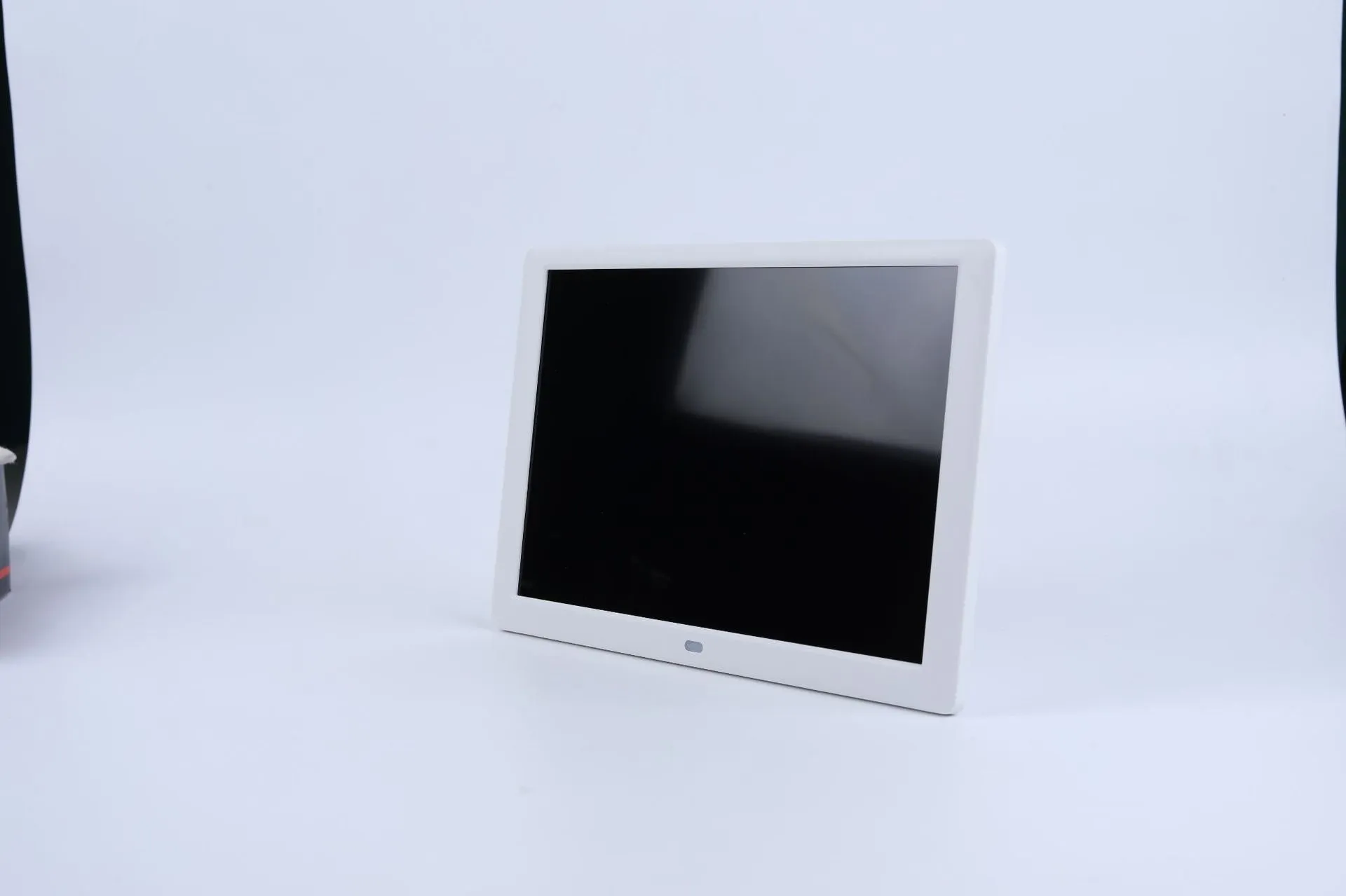 10 inch IPS digital photo frame in black with bracket showing a picture on screen