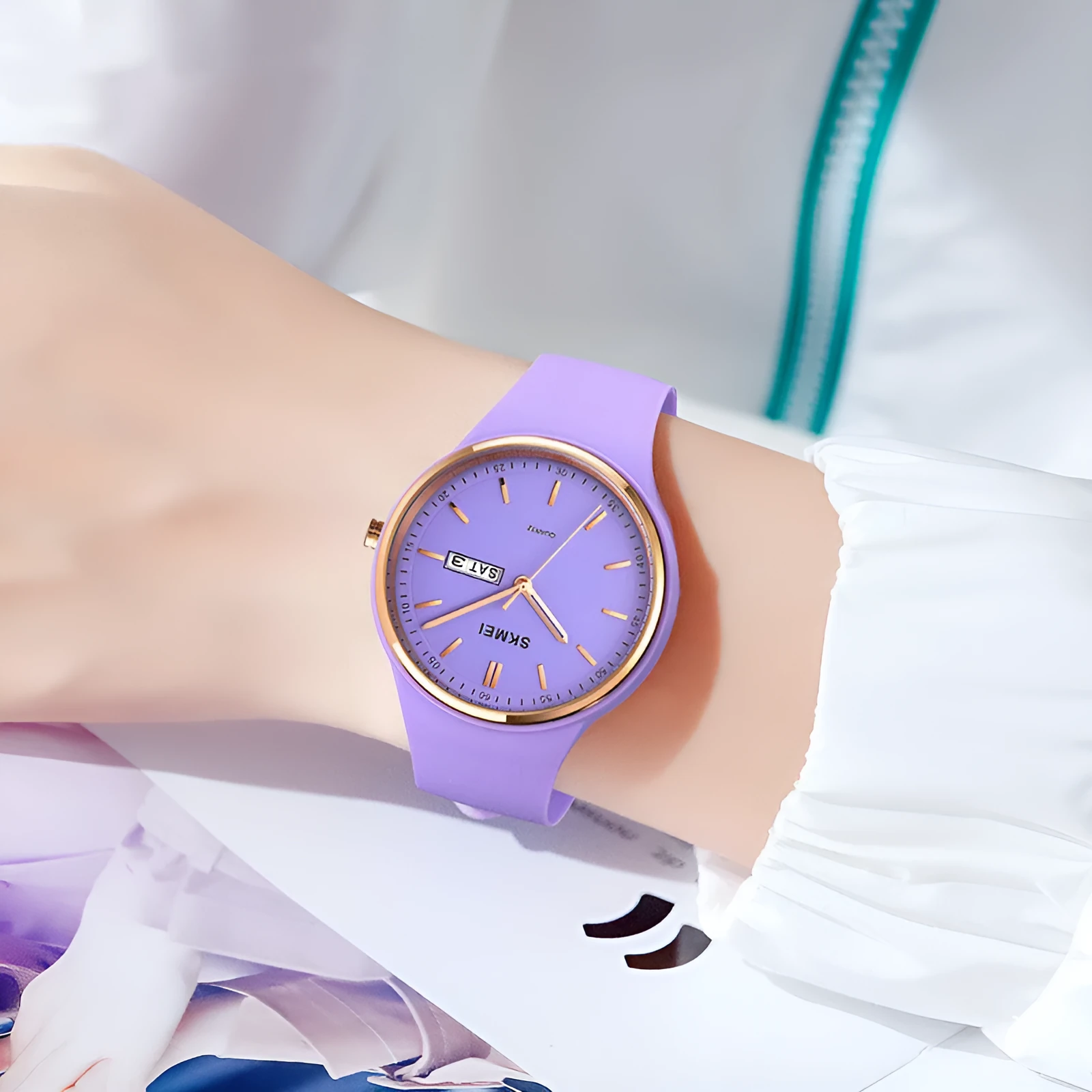 Silicone strap quartz watch for women with a 42mm white dial and calendar display, showing stainless steel pin buckle.