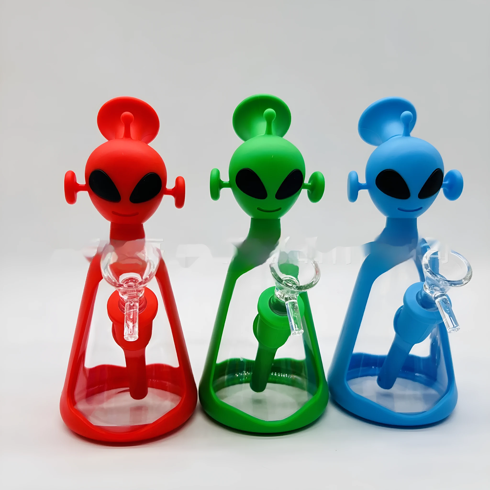 Glass silicone cigarette pipe with clear bowl and blue silicone mouthpiece on white background