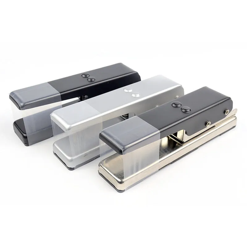 Gold metal guitar pick card cutter on a flat surface showing the punch head and metallic finish