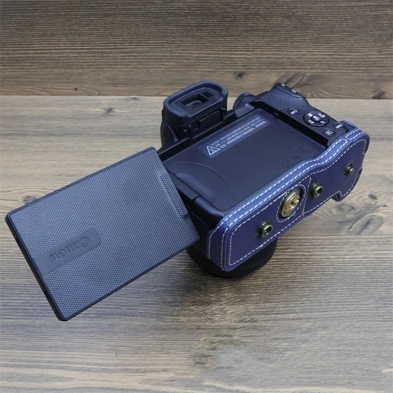 Retro PU camera bag for mirrorless cameras, shoulder bag style in oil skin brown, placed on a table for home storage.