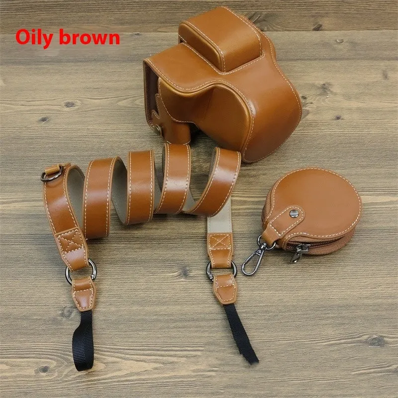Retro PU camera bag for mirrorless cameras, shoulder bag style in oil skin brown, placed on a table for home storage.