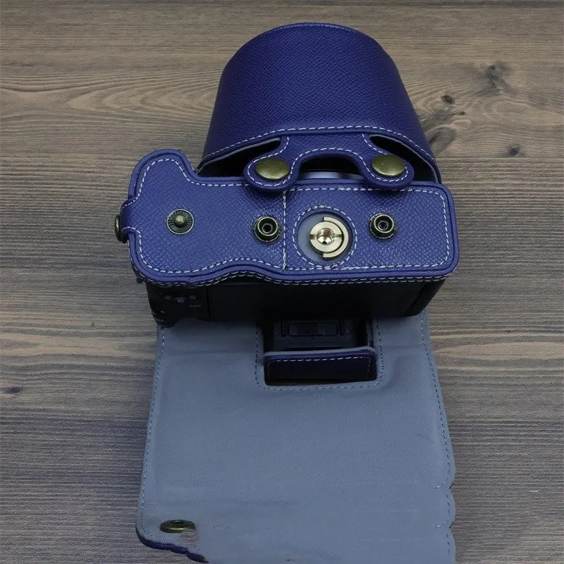 Retro PU camera bag for mirrorless cameras, shoulder bag style in oil skin brown, placed on a table for home storage.