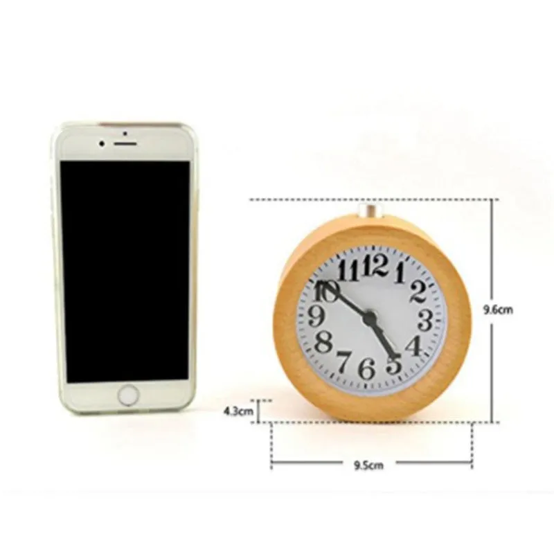 Solid beech wood analogue alarm clock with silent snooze on wooden surface