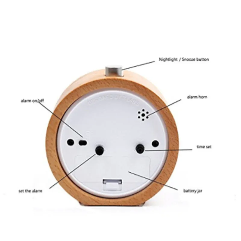 Solid beech wood analogue alarm clock with silent snooze on wooden surface