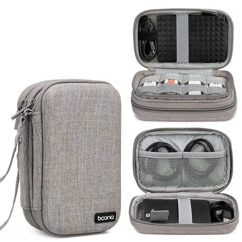 Grey and black Oxford cloth protective storage bags for 2.5-inch portable hard drives on a table.