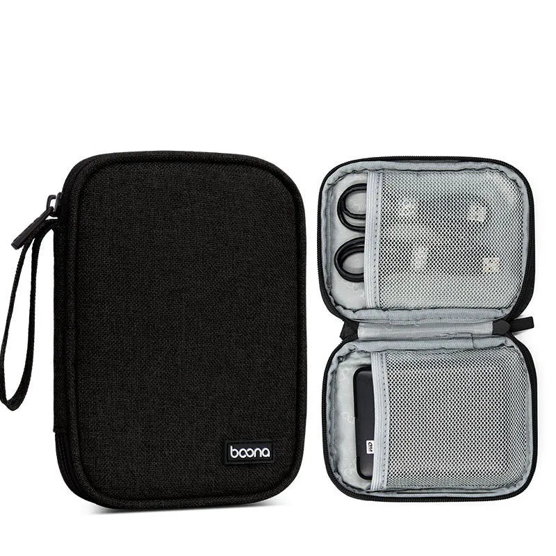 Grey and black Oxford cloth protective storage bags for 2.5-inch portable hard drives on a table.