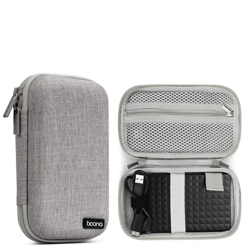 Grey and black Oxford cloth protective storage bags for 2.5-inch portable hard drives on a table.