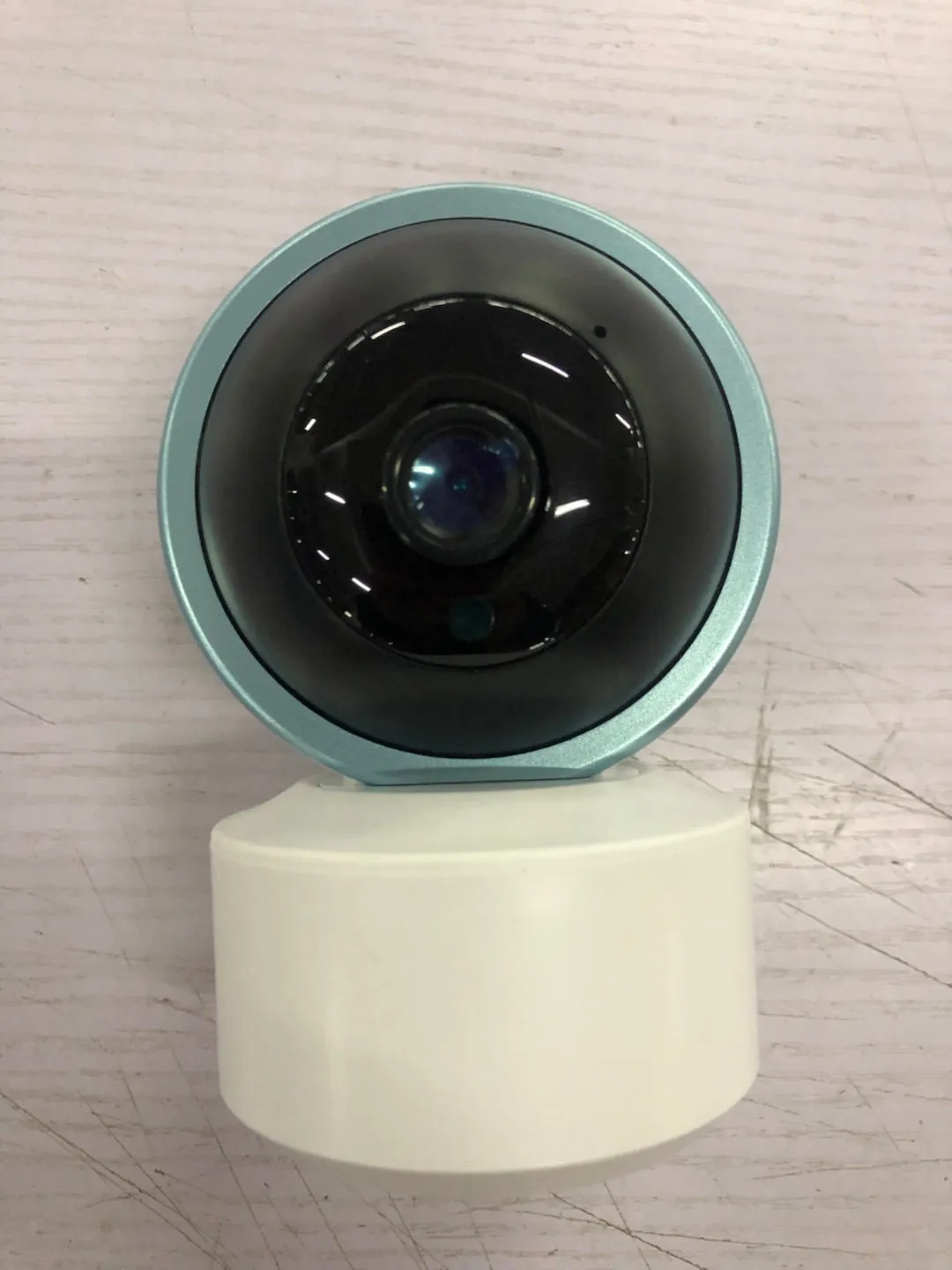 Indoor 360 degree wifi security camera with ABS housing showing rotation capability