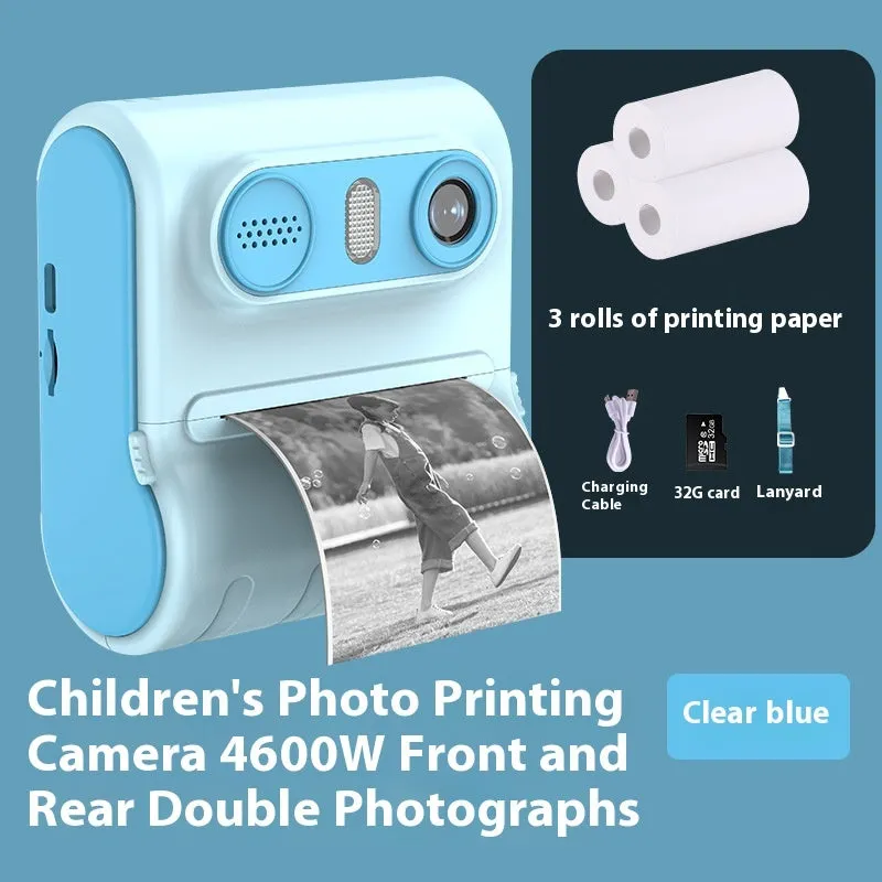 Children's instant printing camera with dual HD cameras in pink colour, showing included lanyard and printing paper