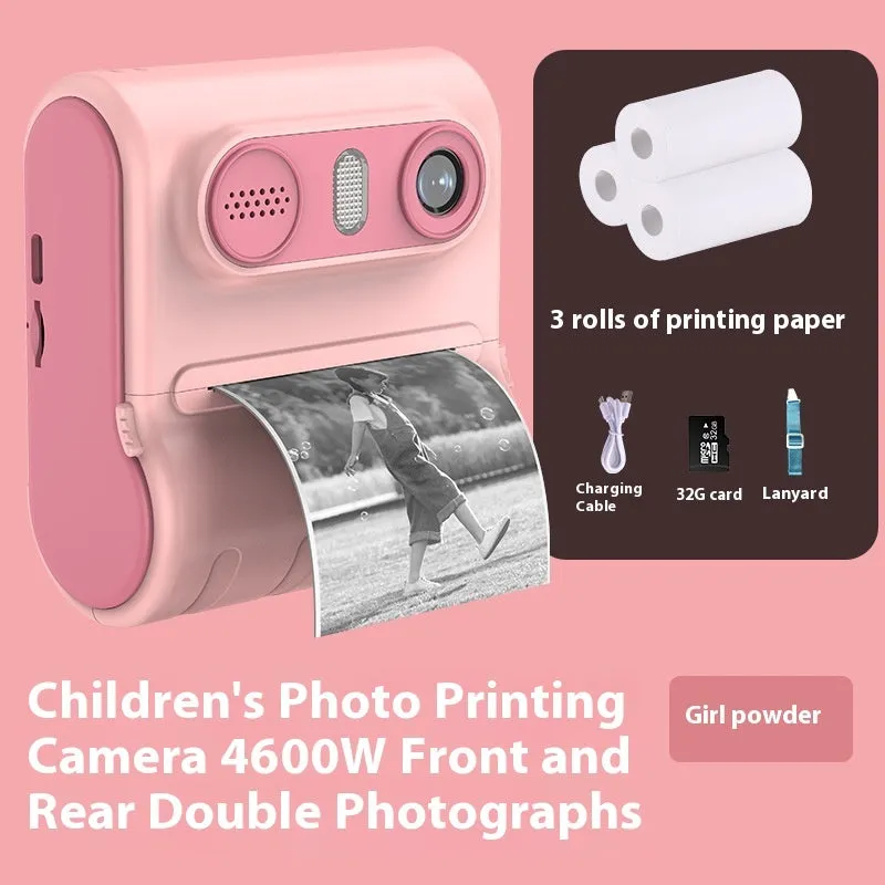 Children's instant printing camera with dual HD cameras in pink colour, showing included lanyard and printing paper