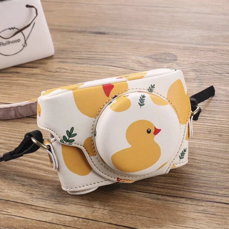 Black imitation leather portable card camera bag with crossbody strap on a solid background