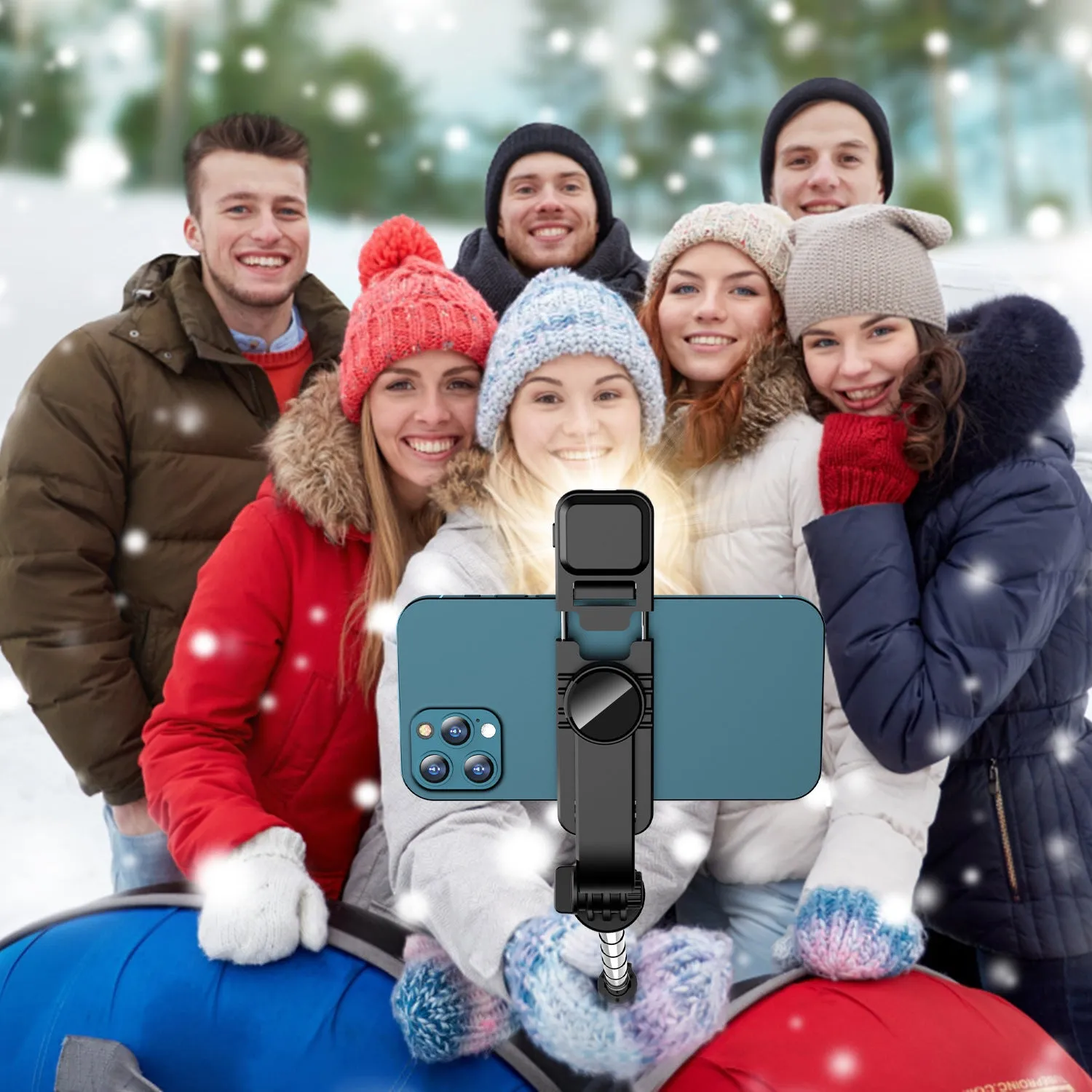 Portable retractable selfie stick tripod with Bluetooth remote and stainless steel shaft in black on a flat surface