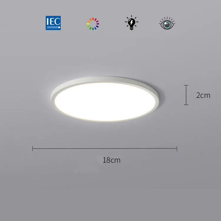Ultra-thin round white LED ceiling lamp with aluminium frame and acrylic shade on ceiling