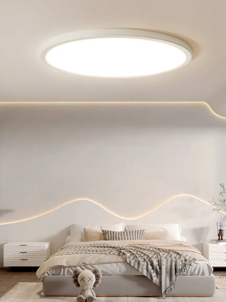 Ultra-thin round white LED ceiling lamp with aluminium frame and acrylic shade on ceiling