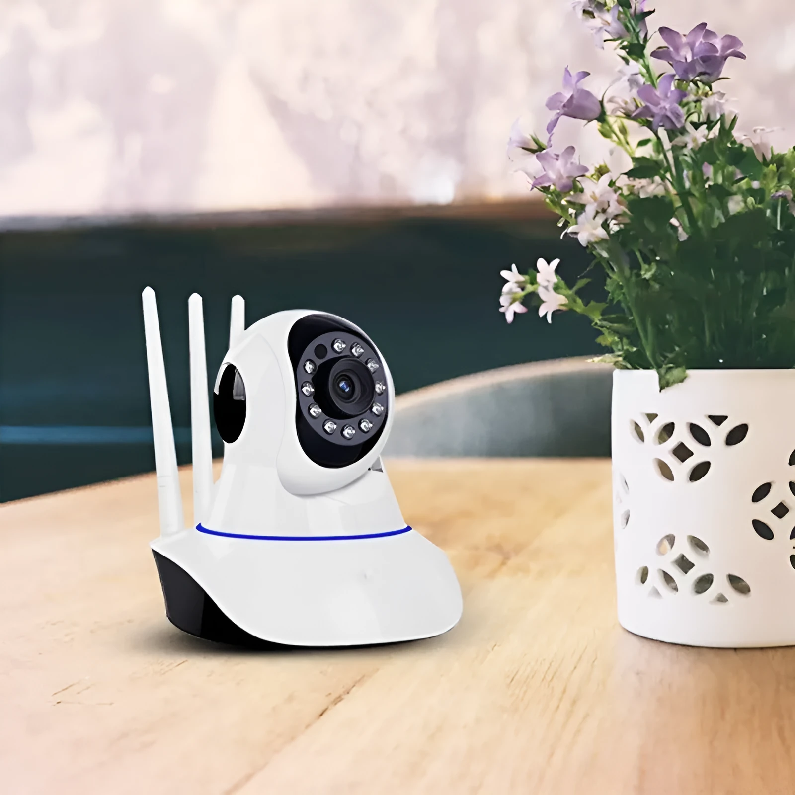 White dome-shaped wireless network security camera with a 3.6mm lens.