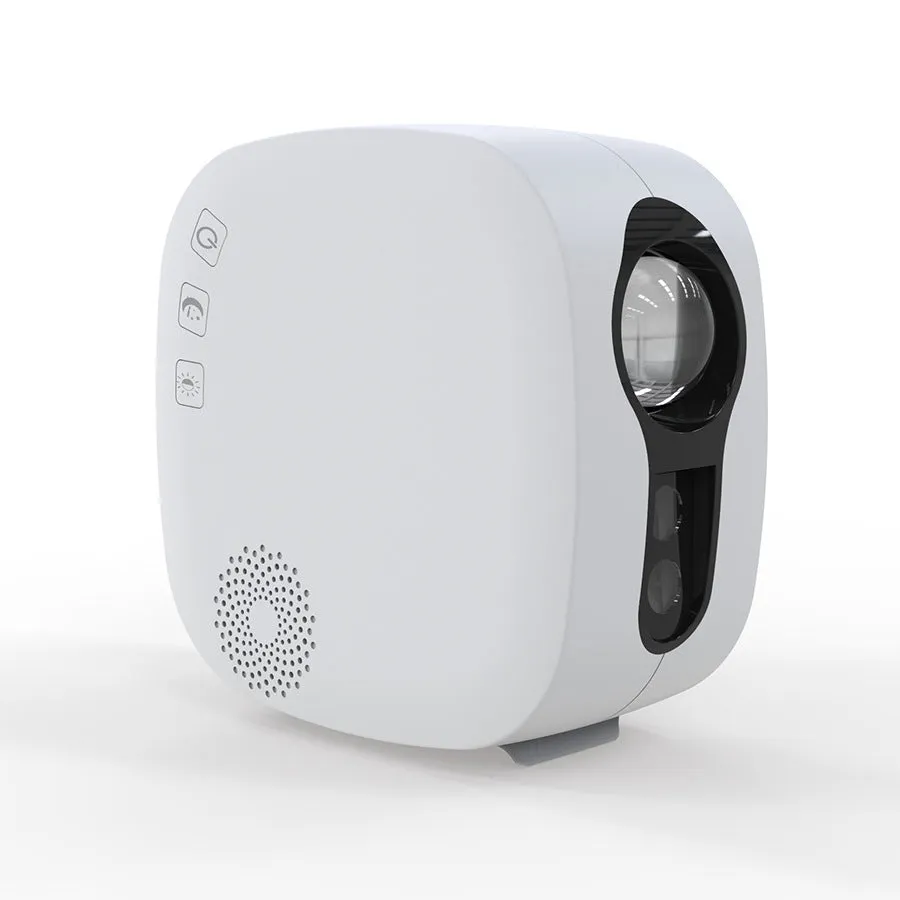 Black cube laser star projector showing nebula and moon display on a wall.