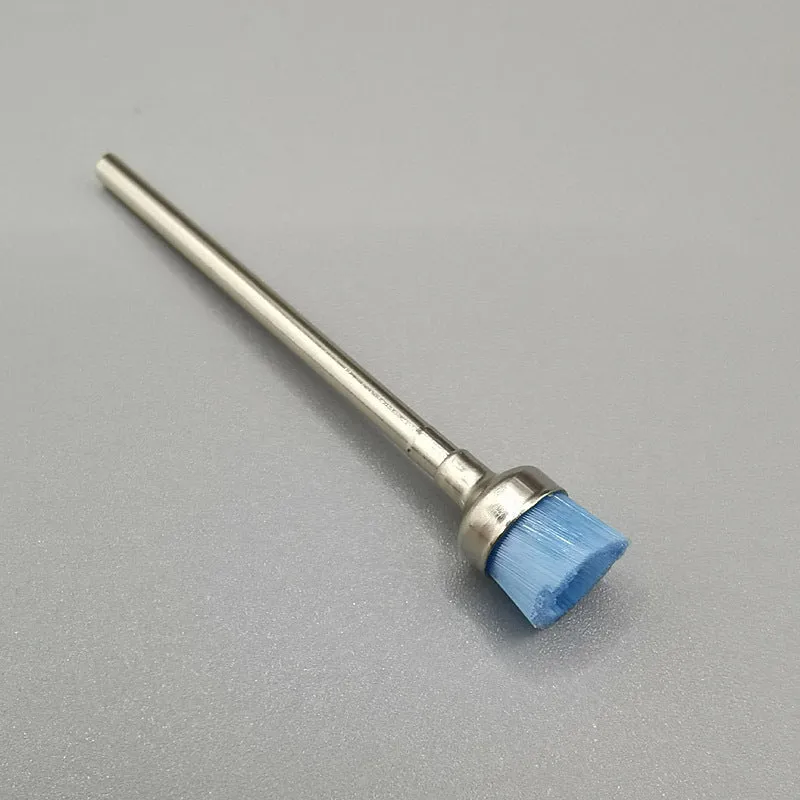 Polishing brush for cleaning nail grinding heads, available in multiple colours, with a simple handheld design.