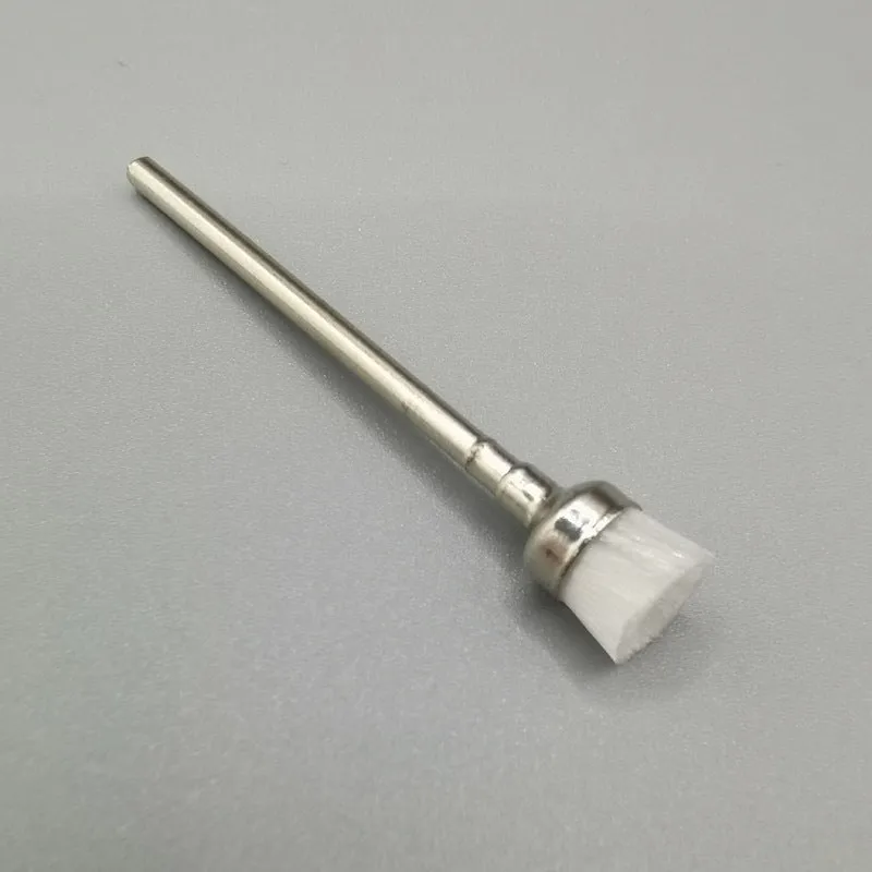 Polishing brush for cleaning nail grinding heads, available in multiple colours, with a simple handheld design.