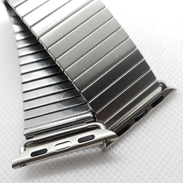 Silver stainless steel elastic Apple Watch band on a wrist, compatible with 38mm to 44mm cases