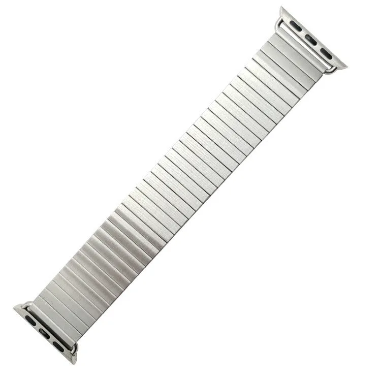 Silver stainless steel elastic Apple Watch band on a wrist, compatible with 38mm to 44mm cases