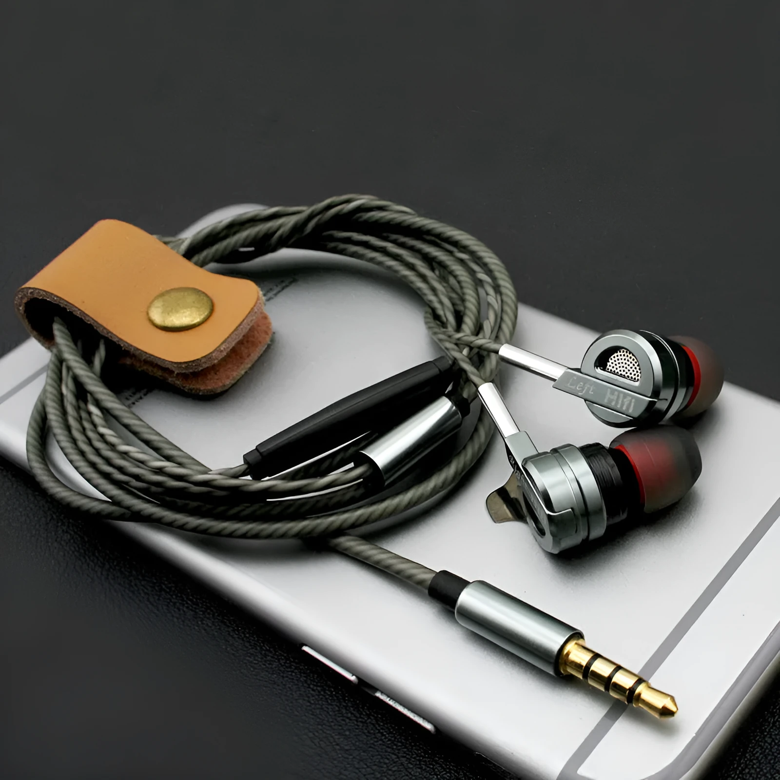 Black and silver metal HIFI earphones with wire controls showing double moving coil and dual horn bass design