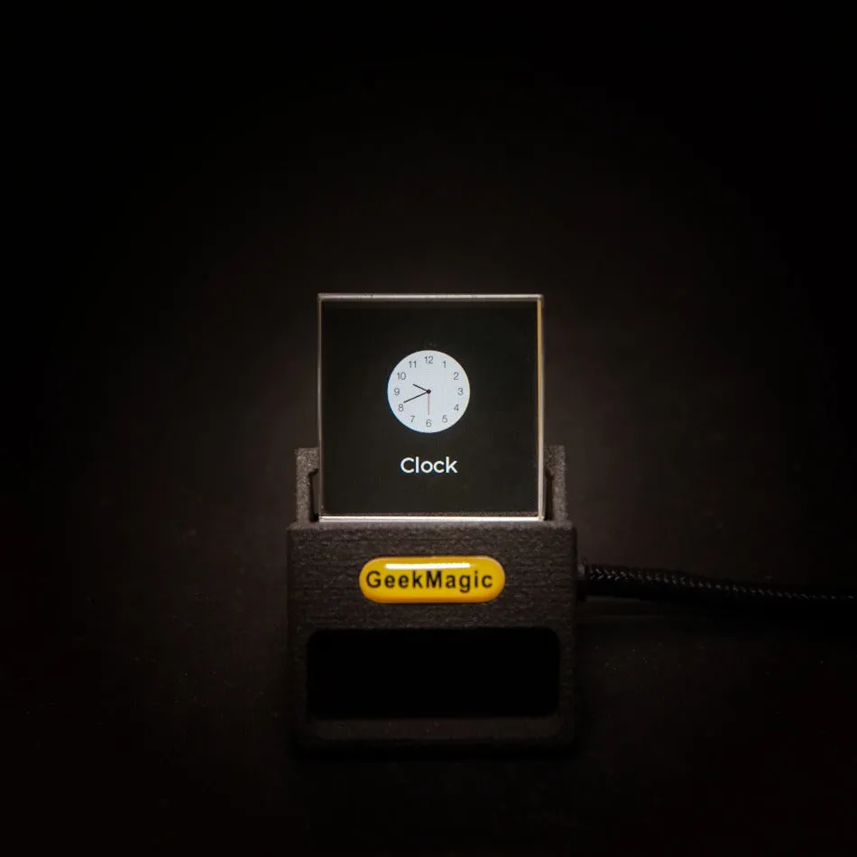 Multifunctional desk clock displaying weather, world clock, and stock market data on a desk