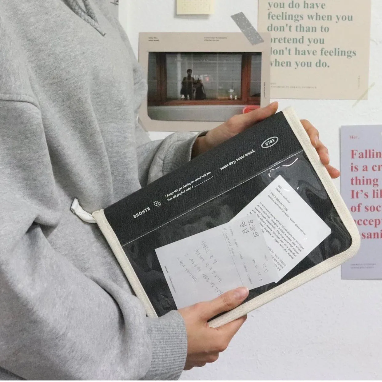 Canvas tablet storage bag with zipper opening and soft handle designed for 12-inch devices, shown in black and white colours