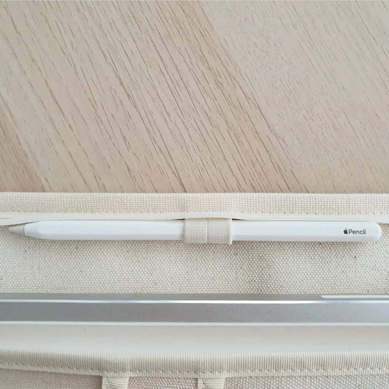 Canvas tablet storage bag with zipper opening and soft handle designed for 12-inch devices, shown in black and white colours