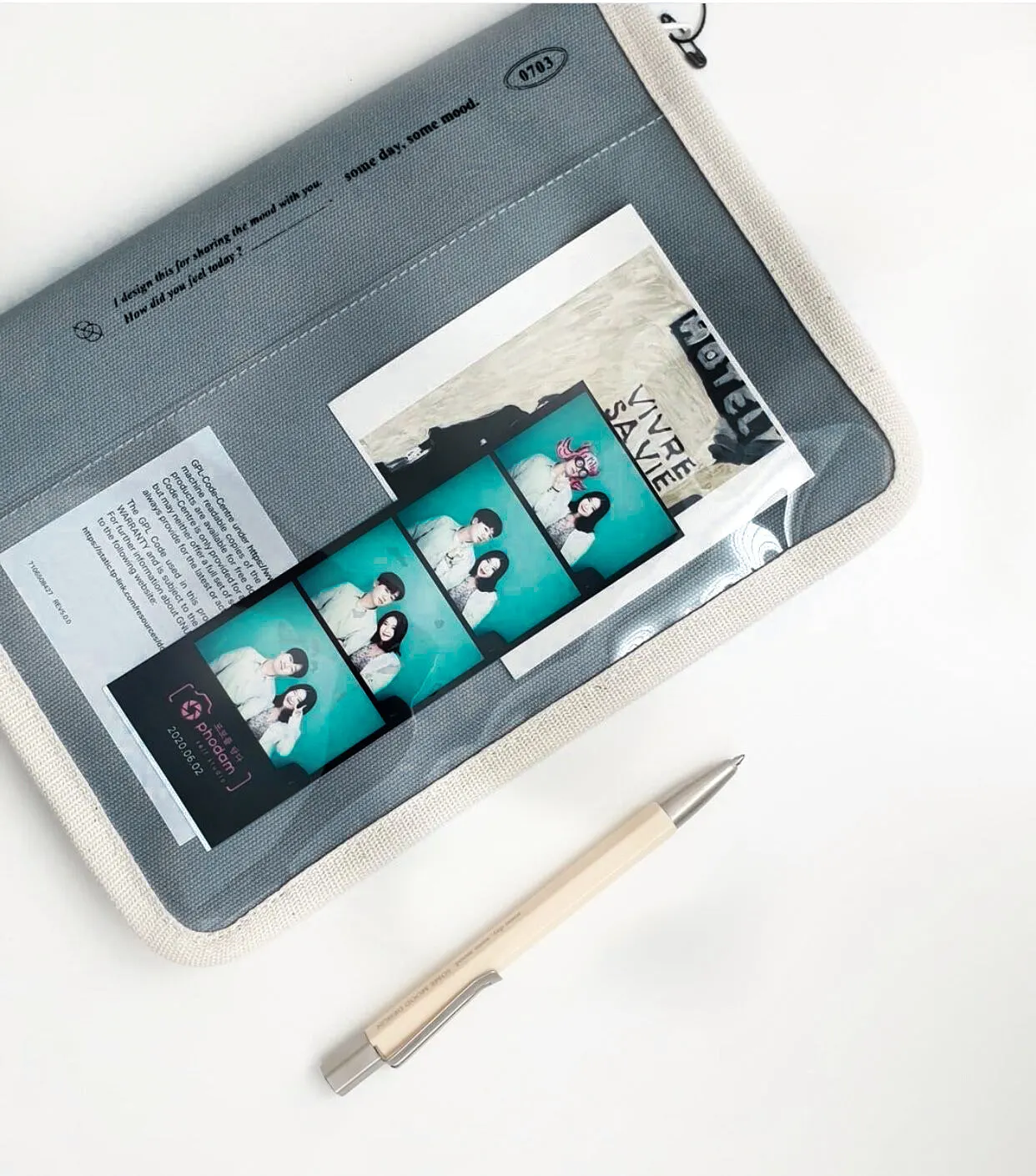 Canvas tablet storage bag with zipper opening and soft handle designed for 12-inch devices, shown in black and white colours