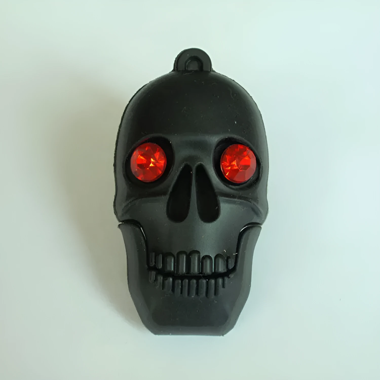 Halloween skeleton skull shaped USB flash drive on a keychain, showing PVC shell in a selected style.