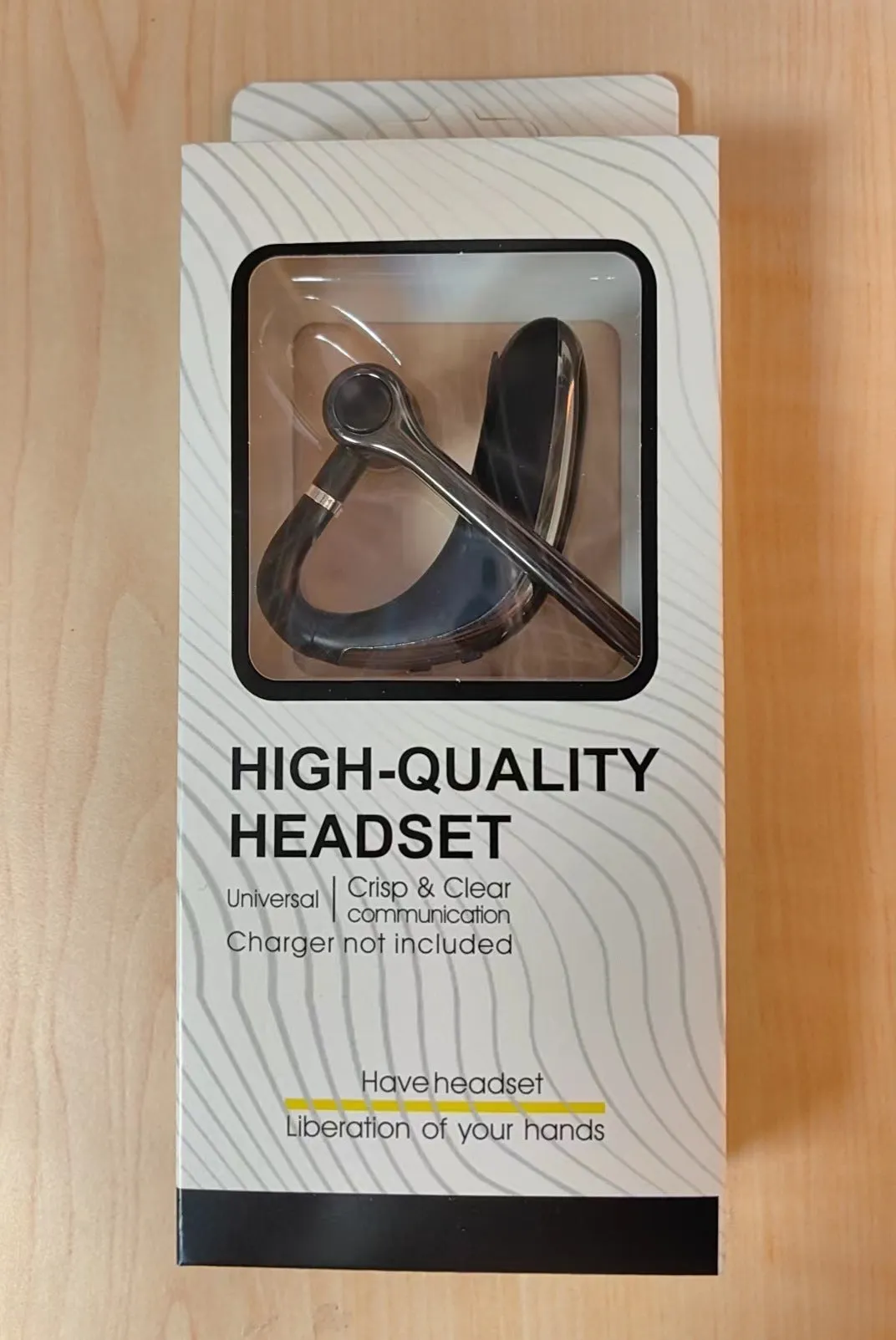 Wireless Bluetooth single-ear headset with digital display, ear-mounted design in black or white