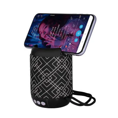 Mini wireless Bluetooth speaker with fabric covering in blue, showing button controls and compact size