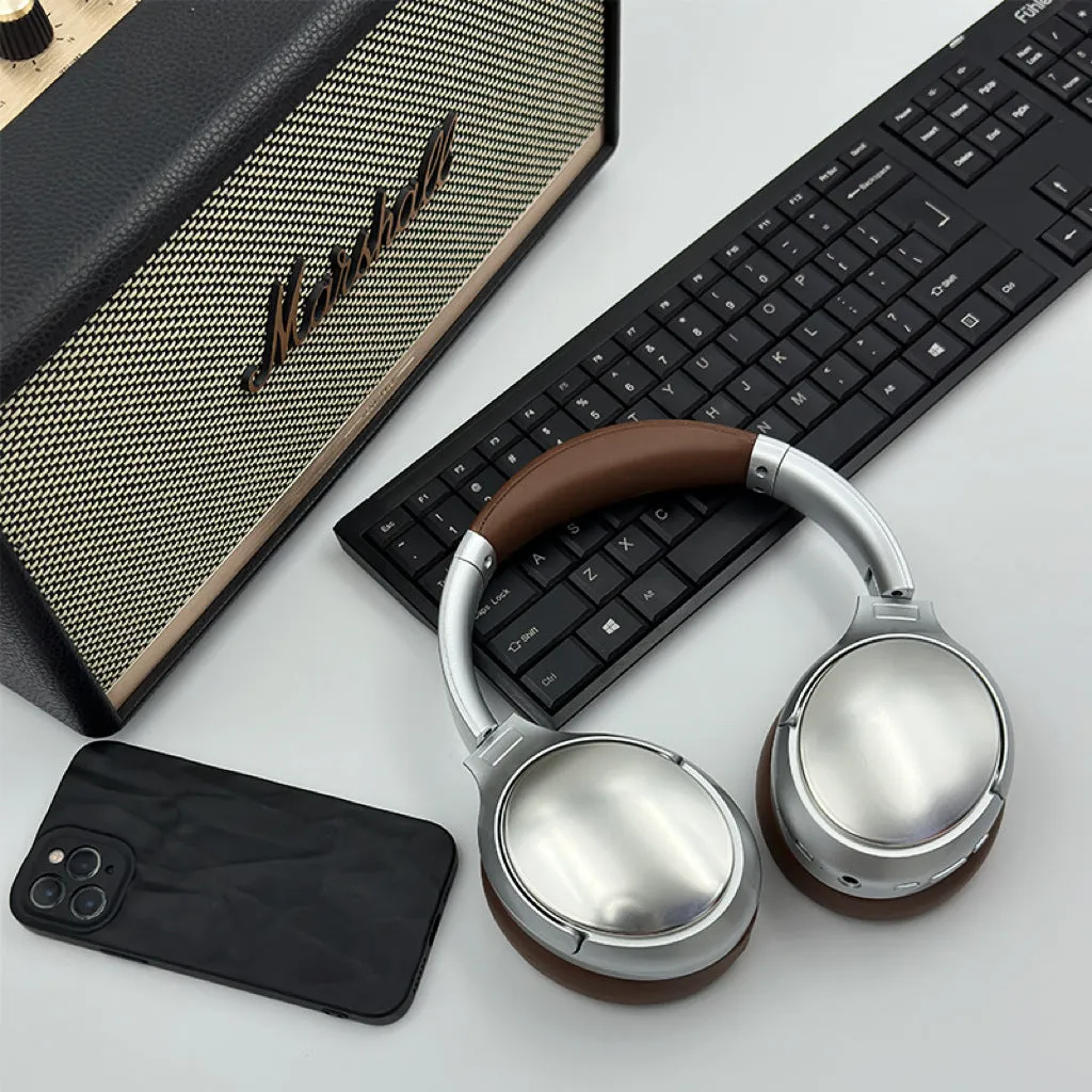 Retro-style brown wireless Bluetooth headset with metal details and sport headband design.