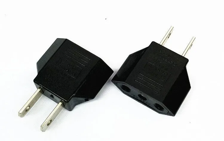 Compact black three-outlet travel plug converter adapter with AU plug type on a white background