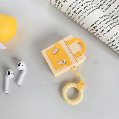 Silicone protective sleeve for AirPods 1 and 2 charging case with hanging ring, available in dark blue, green, purple, and yellow colours