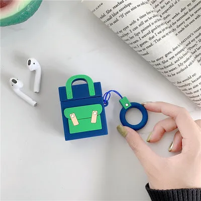 Silicone protective sleeve for AirPods 1 and 2 charging case with hanging ring, available in dark blue, green, purple, and yellow colours