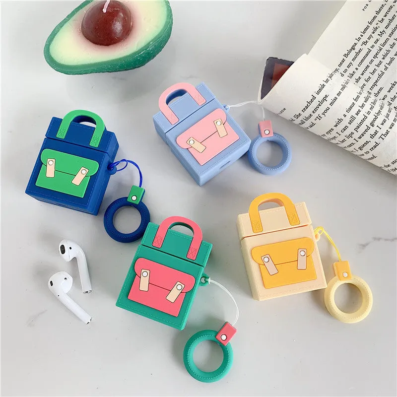 Silicone protective sleeve for AirPods 1 and 2 charging case with hanging ring, available in dark blue, green, purple, and yellow colours