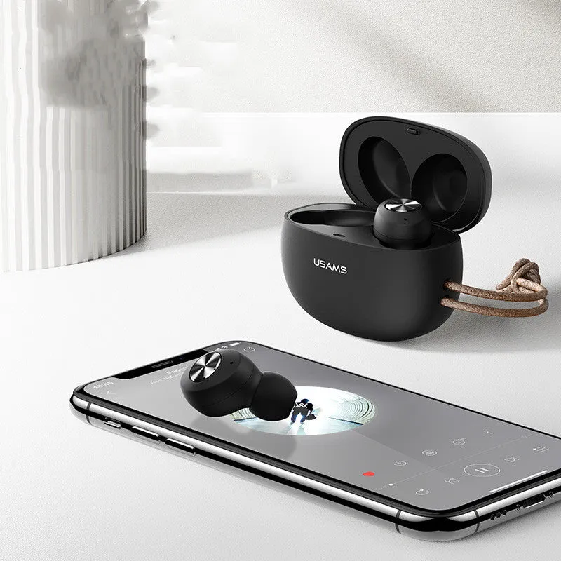 Pebble Series mini wireless Bluetooth earbuds and charging case in black, placed on a white surface.