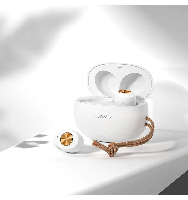 Pebble Series mini wireless Bluetooth earbuds and charging case in black, placed on a white surface.
