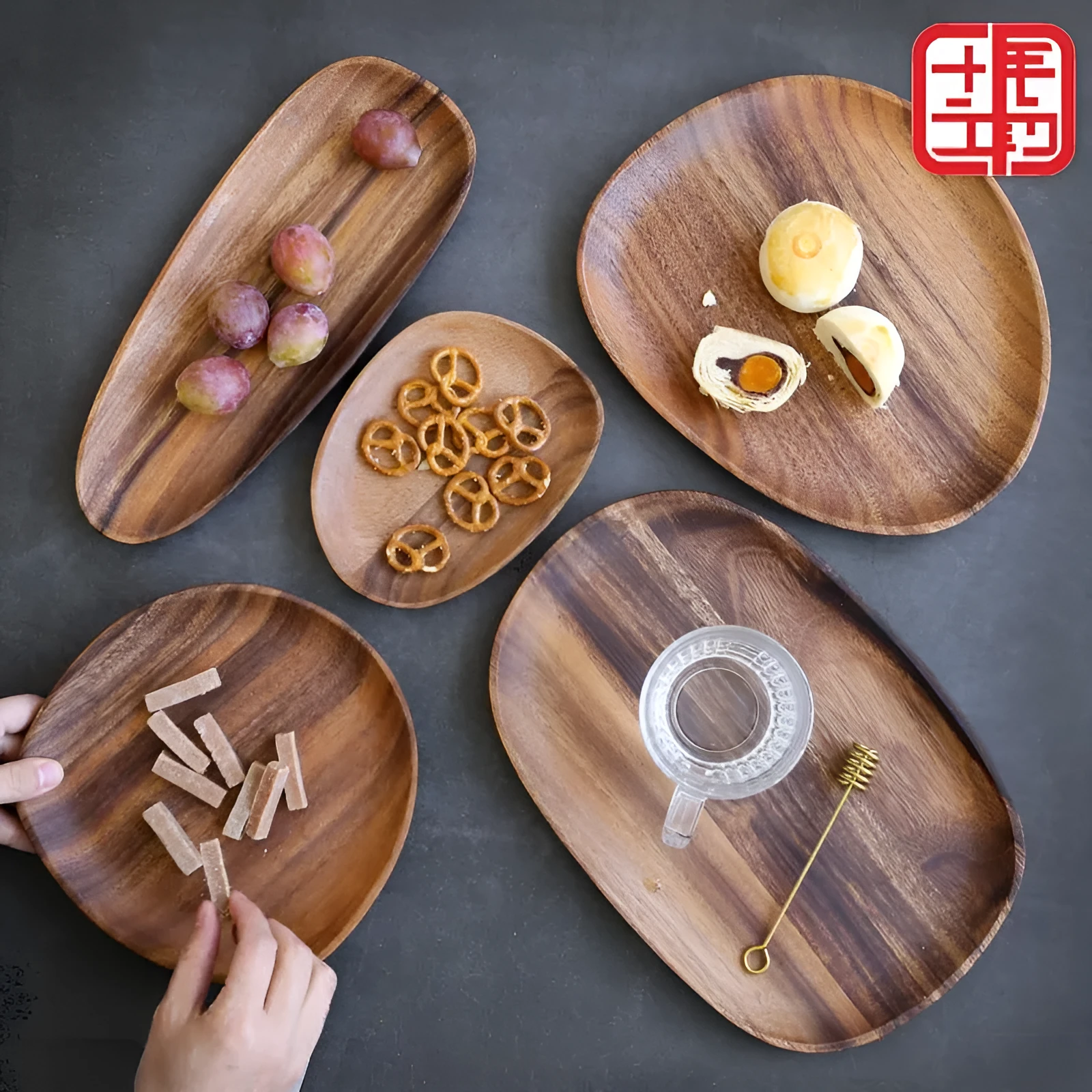 Acacia Japanese snack plate hand-polished natural wood with visible grain and mineral lines on a flat surface