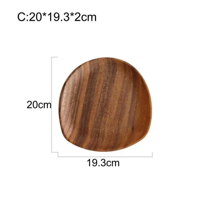Acacia Japanese snack plate hand-polished natural wood with visible grain and mineral lines on a flat surface