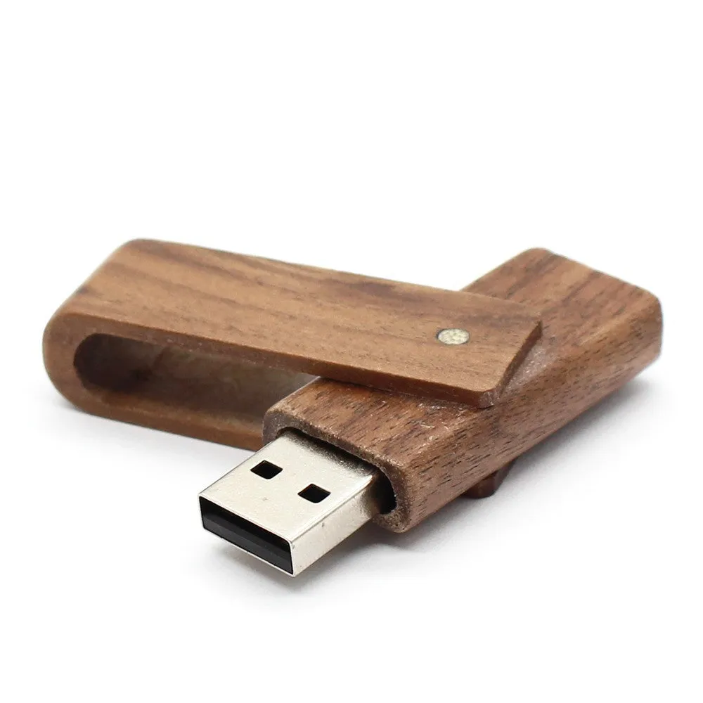 Pink wooden USB flash drive with rotating clip on a light background showing its natural wood grain and compact size