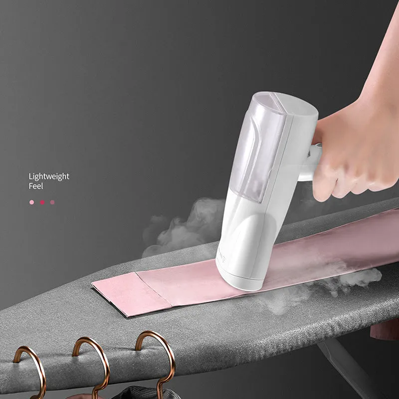 White folding ironing machine with 800W steam function, compact folded size 10cm by 6.2cm by 18cm, includes long hair brush