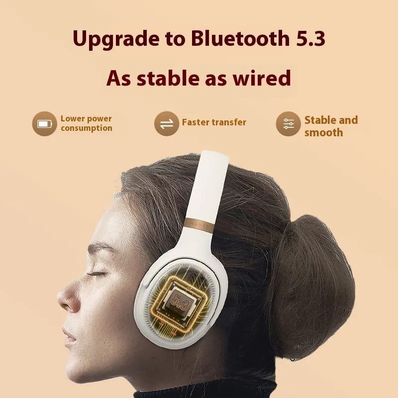 Cream coloured wireless Bluetooth over-ear gaming headset with microphone on a black background.