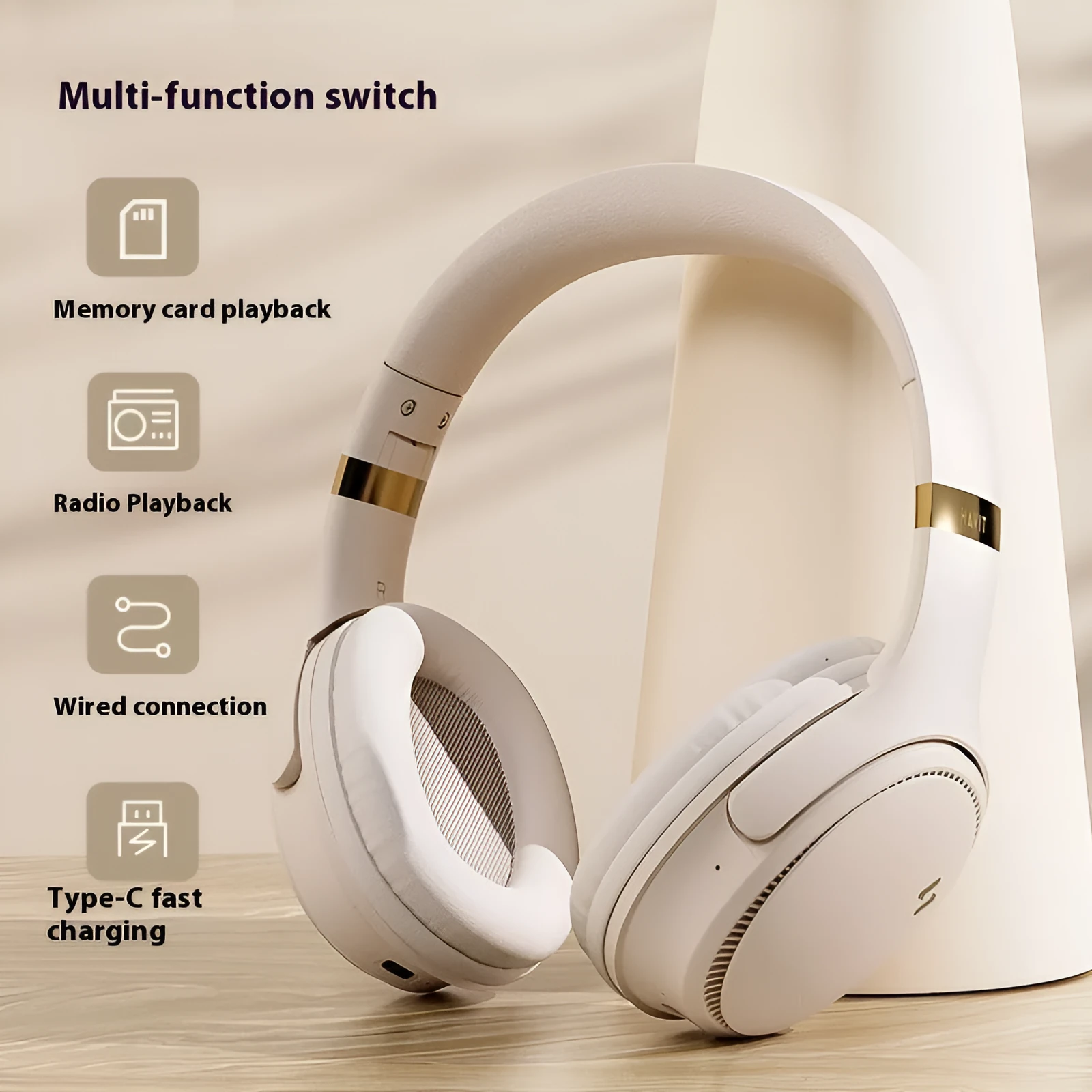Cream coloured wireless Bluetooth over-ear gaming headset with microphone on a black background.